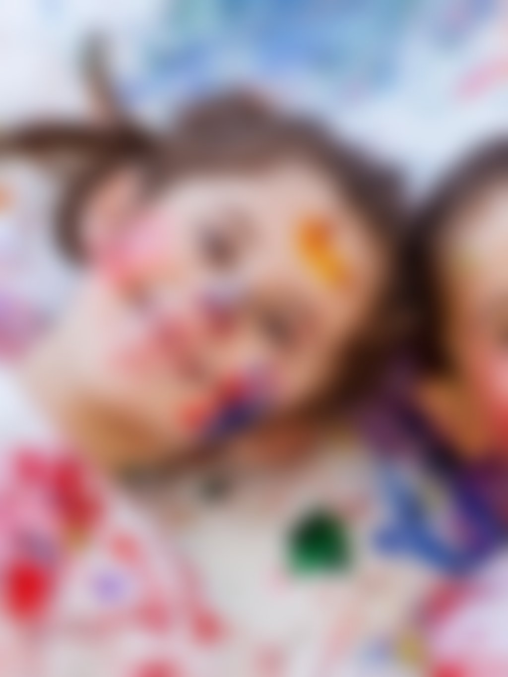 Girl and boy paint splattered d