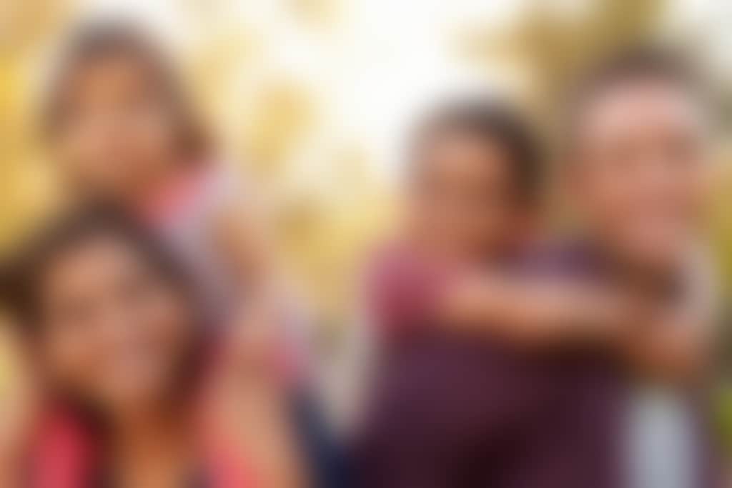 Family of four outdoors d