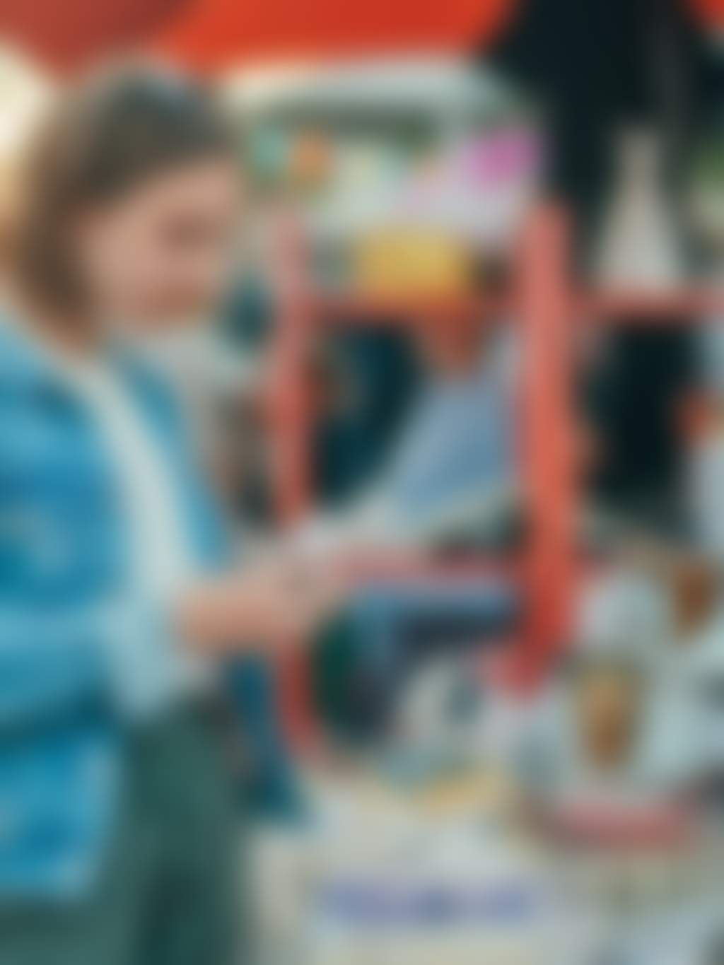 Girl browsing skincare products stall