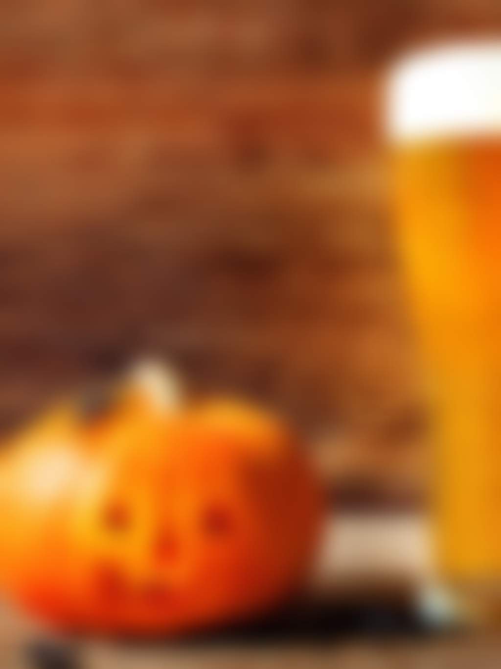 Halloween pumpkin and spiders with beer