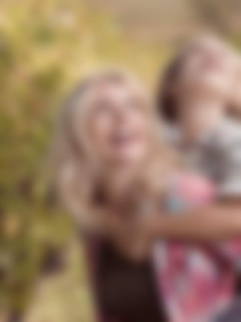 Mother and son amongst grapevines