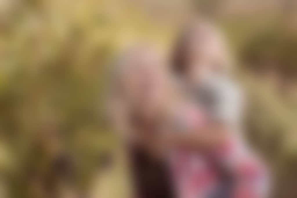 Mother and son amongst grapevines