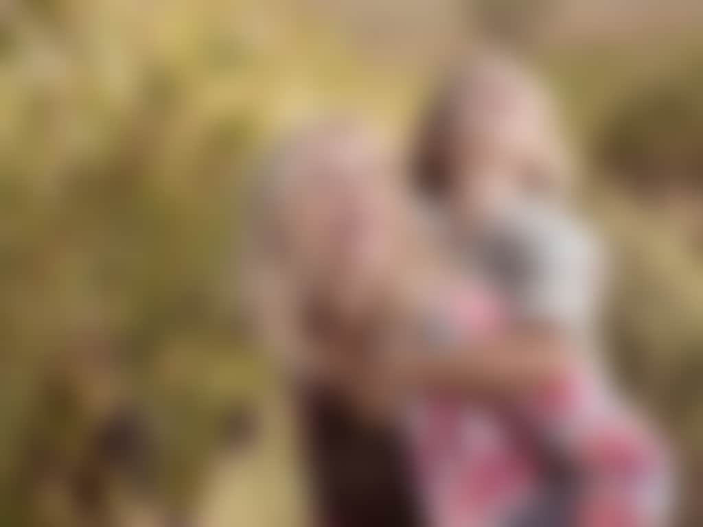 Mother and son amongst grapevines