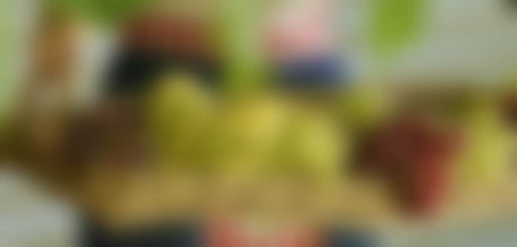 Lady holding basket of grapes 2776x2776