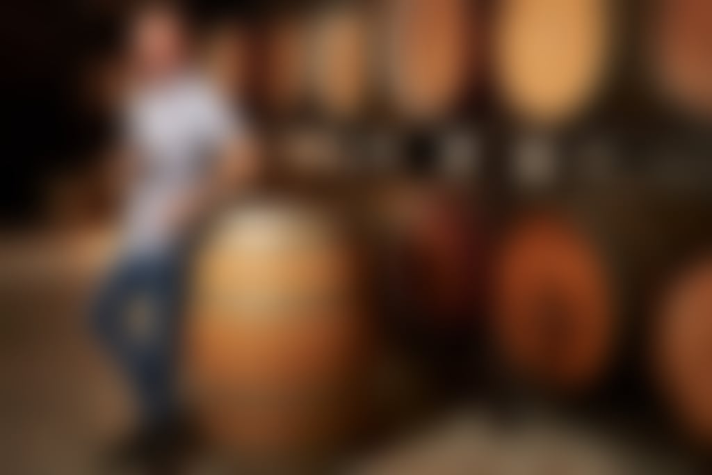 Arch Kosovich tasting wine