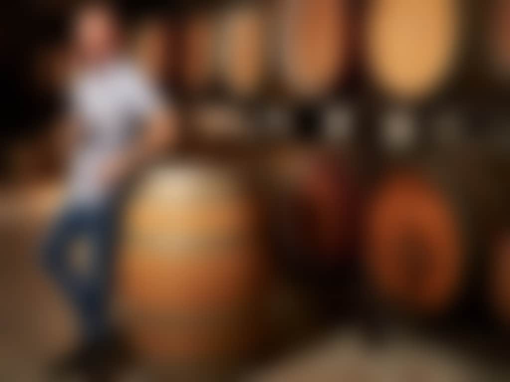 Arch Kosovich tasting wine